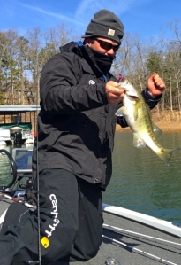 We can tell for sure that's a nice bass coming into the boat for Monroe's Brett Preuett on Day 1. Brett, that is you under there, isn't it? It's only 10 degrees over there... 